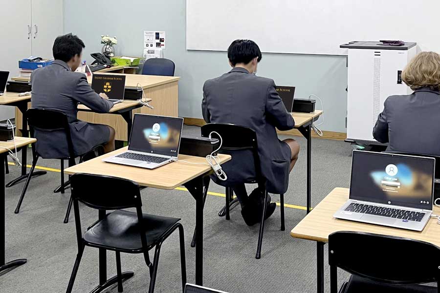 Sydney Grammar School, portable battery bank, exam on a laptop