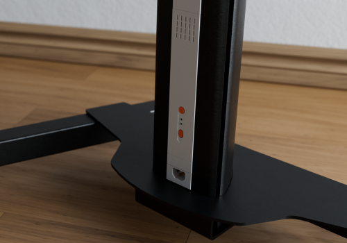 Close-up of a black TV stand base with a vertical silver control panel showing orange buttons and a small ports section.