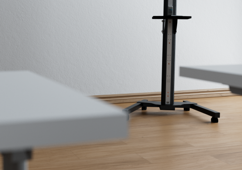 Stadiometer on a wheeled base next to a white wall, used for measuring a person’s height in a bright room.