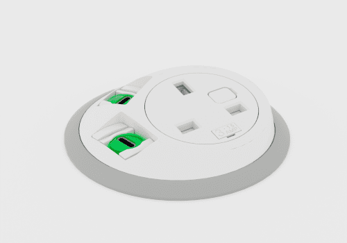 Close-up of a circular white power strip with several rectangular outlets; a green plug is inserted in one slot.